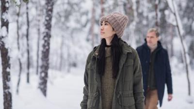 Suominen - man & woman in snow